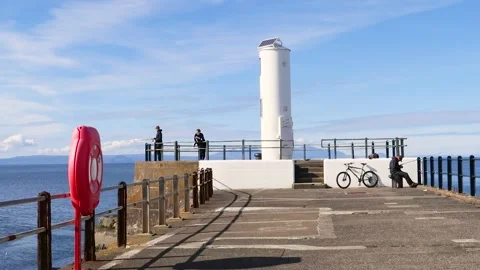 End of pier lighthouse, overlooking the Firth of Clyde, Ayr, Scotland, UK Stock Footage 285649233