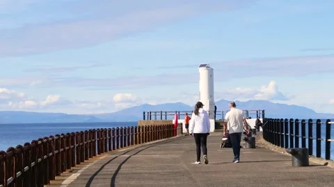 End of pier lighthouse, overlooking the Firth of Clyde, Ayr, Scotland, UK Stock Footage 285649237