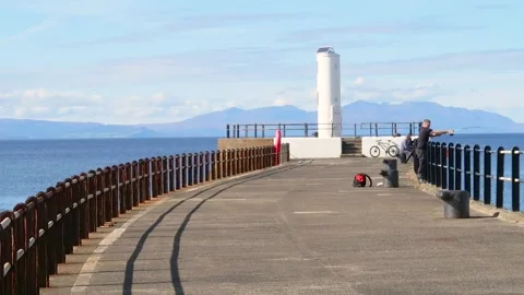 End of pier lighthouse, overlooking the Firth of Clyde, Ayr, Scotland, UK Stock Footage 285649499