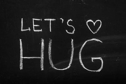 End of quarantine.Chalkboard text message Let's hug Stock Photos