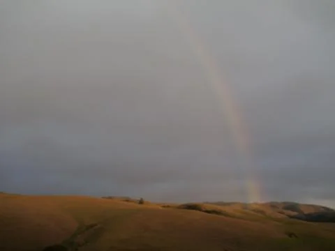 End of a Rainbow in sunset Stock Photos