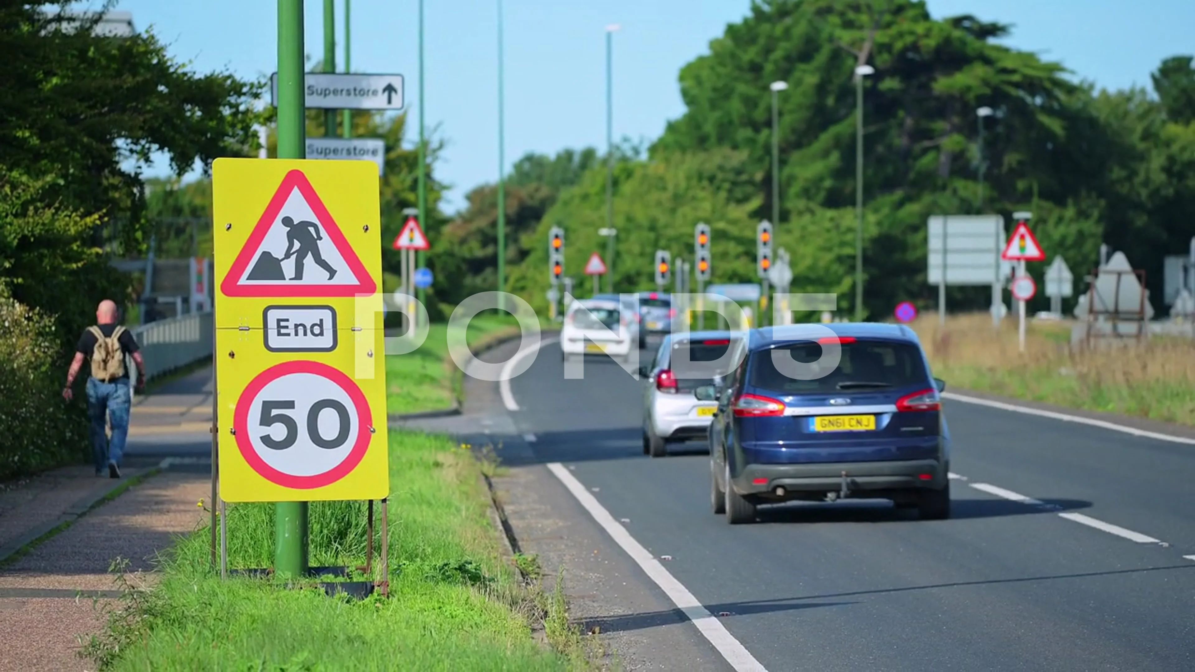 End of roadworks sign 50MPH sign on Stock Video Pond5