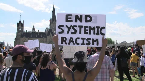 End systemic racism sign at a BLM protest Stock Footage