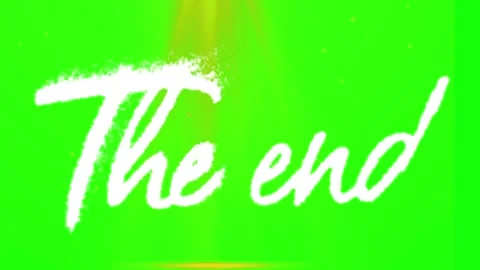 The end text overlay with glowing light effects on a bright green screen Stock Footage 346120835