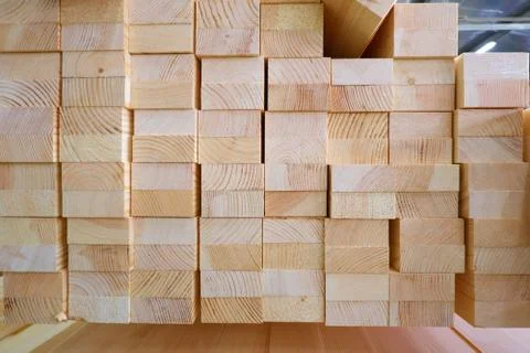 End view of stack of two-layer wooden glued laminated timber beams from pine 스톡 사진