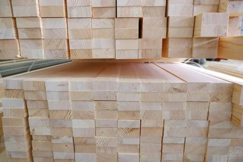 End view of stack of two-layer wooden glued laminated timber beams from pine 스톡 사진