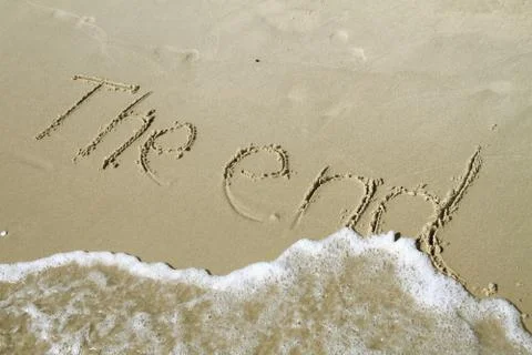 The end writing draw in sand Stock Photos