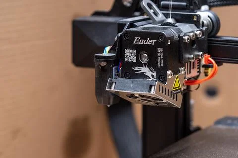 Ender brand 3D printer model moving print head extruder part closeup detail.. Stock Photos