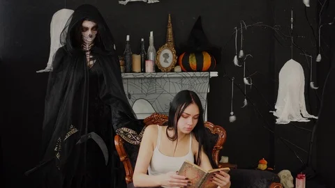 Ender dreamy brunette reader unaware of spooky Halloween Death Reaper scary Stock Footage 96210096