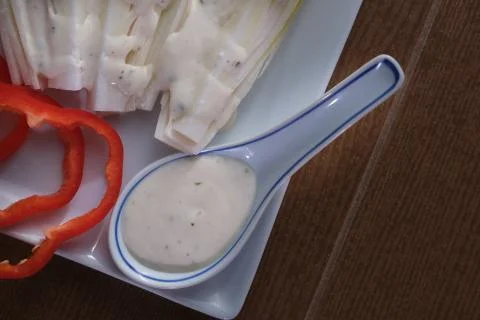 Endive salad with caesar sauce Stock Photos