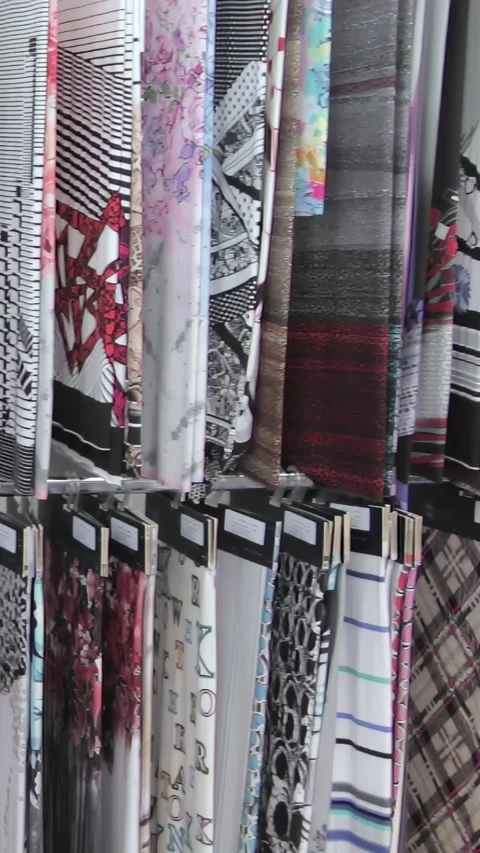 Endless Array of Vibrant Patterns in a Textile Showroom Display Vídeo Stock 344617802