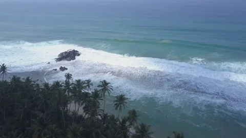 Endless blue ocean waves with white foam roll on coastline Stock Footage 145864471