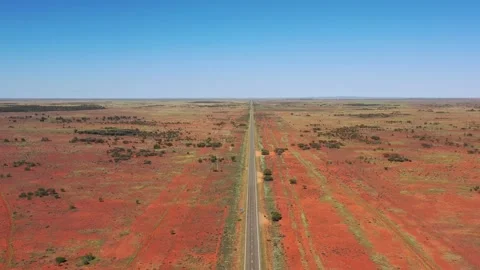Endless blue sky down to red soil and empty Barrier highway in aerial 4k. Stock Footage 169888841