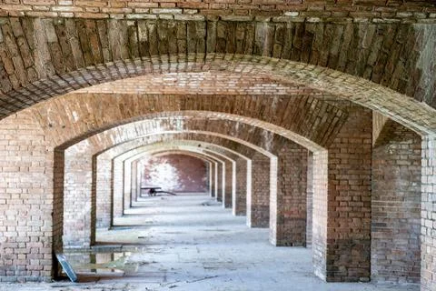Endless brick passage with repeating archways in Fort Jefferson on Dry Tortugas Stock Photos