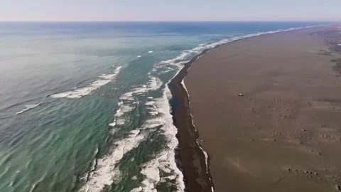 Endless brown sand beach and ocean in Iceland, aerial dolly in, empty Stock-Footage 281541193