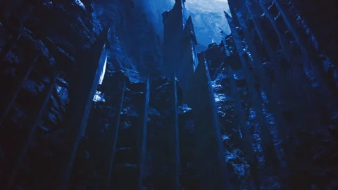 Endless chasm corridor framed by towering stone spires under luminous galaxy Stock Footage 343626838