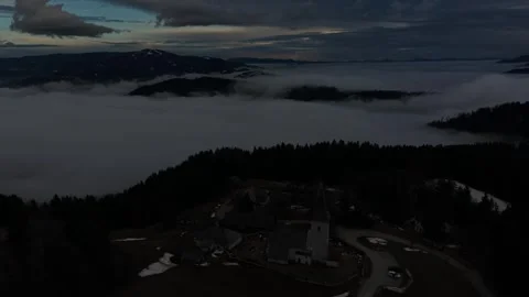 Endless clouds rolling through forested mountains Stock Footage 328493638