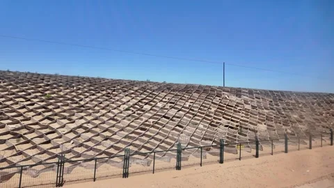 Endless Desert Landscape Seen from a Train During a Long Journey in Xinjiang Stock Footage 343707778