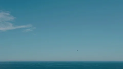 The endless expanses of the ocean. Clear blue sky and calm waves. Stock Footage 113353568