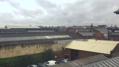 Endless factory buildings stretch into a desolate urban city landscape Stock-Footage 72176740