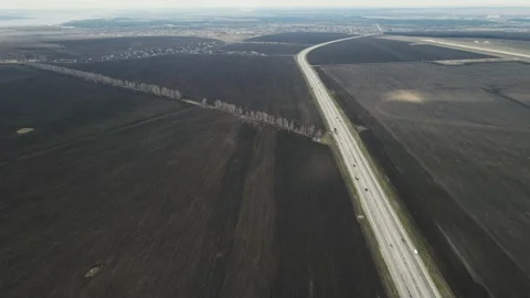 Endless fields along which the track goes. aerial shooting Stock Footage 154096306