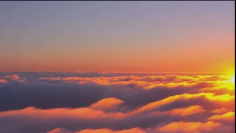 An endless flight through amazing pink clouds sunrise. Daytime. Loop Stock-Footage 295231034