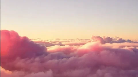 An endless flight through amazing pink clouds sunrise. Daytime. Loop Stock-Footage 295231036