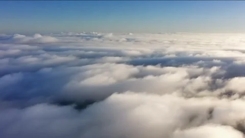 An endless flight through the clouds. Daytime. Realistic 3d animation. Loop. Video stock 295231043