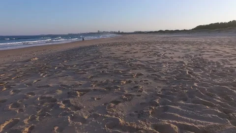 Endless footprints on Australian beach at sunset Video stock 134006409