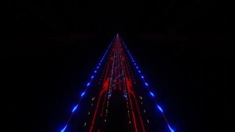 Endless forward movement in a dark tunnel of lattice with flashing red and blue  Stock Footage 306158031