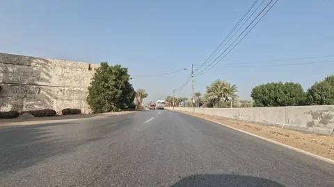 Endless highway scenery along Cairo Fayoum Desert Road through Egyptian desert Stock Footage 329842435