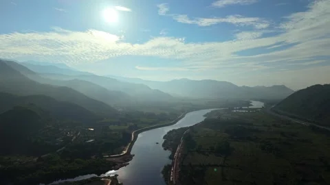 Endless Mountain Layers Above Winding River at Sunrise Stock Footage 336857083