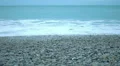 Endless ocean, foamy waves washing up on clean pebble beach, nature conservation HD Footage