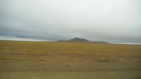 The endless plains of Patagonia scroll by from the road, in Chile Stock Footage 237031167