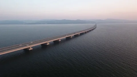 Endless road low-water bridge Amursky gulf De-friz Vladivostok Russia Aerial car Stock Footage 75801565