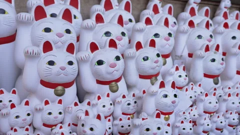 Endless rows of white Maneki-neko lucky cats on temple shelves. Stock Footage 336700419