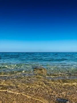 Endless sea tranquil reflection clear, serene mirror Stock Photos