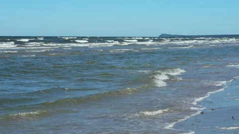 Endless sea waves rush onto the coast on the Baltic Sea. Slow motion. Stock Footage 277875583