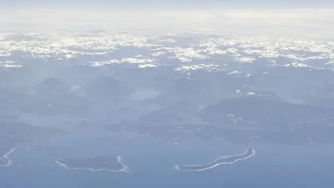 Endless Snow-Capped Coast Mountains Above the Deep Inside Passage Fjords Video stock 336219525