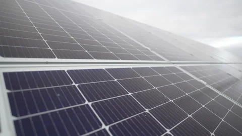 Endless solar panel catches sunlight through clouds Stockbeeldmateriaal 310230549