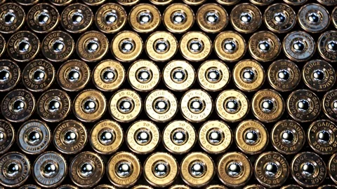 The endless stack of a rifle or machine gun ammunition standing one by one. 4KHD Stock Footage 102678436