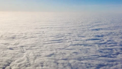 Endless textured carpet thick white clouds stretches pale horizon soft blue sky Stock Footage 327644064