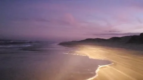 Endless Tide: Gentle Surf Flowing Over Sunlit Sands Stock Footage 330964146