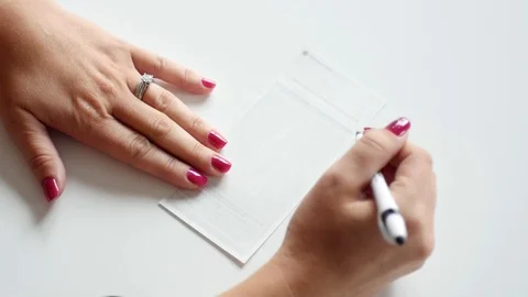 Endorsing the back of a check Stock Footage 91176496