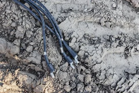 The ends of the electrical cable in the trench. Electrical cable installation Photos