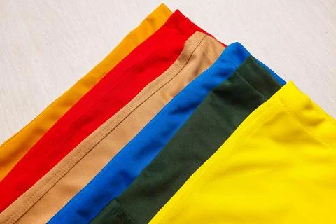 The ends of the trousers are in various bright colors such as yellow, red, .. Stock Photos