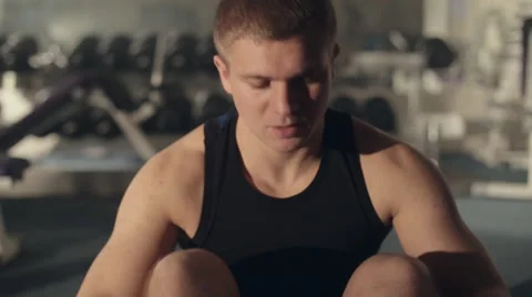 Endurance man doing abdominal exercises on floor Stock Footage 48993683