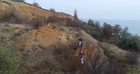 Enduro bikers rides along the wild nature Stock Footage 103426853