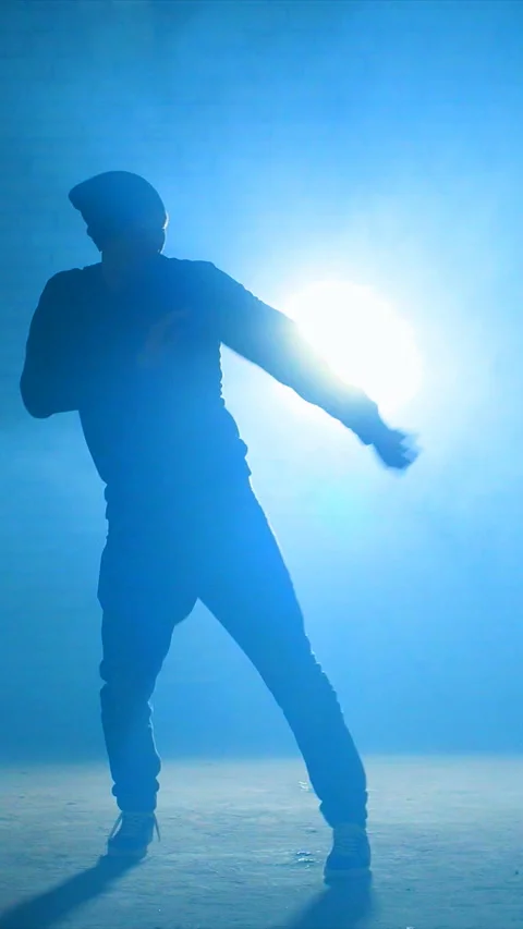 An Energetic and Dynamic Dance Performance Featuring Stunning Blue Lighting Stock Footage 315169692