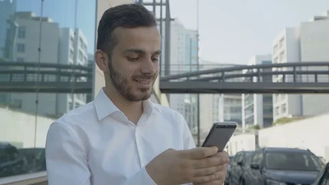 Energetic Caucasian young manager replying to text message Stock Footage 97915369